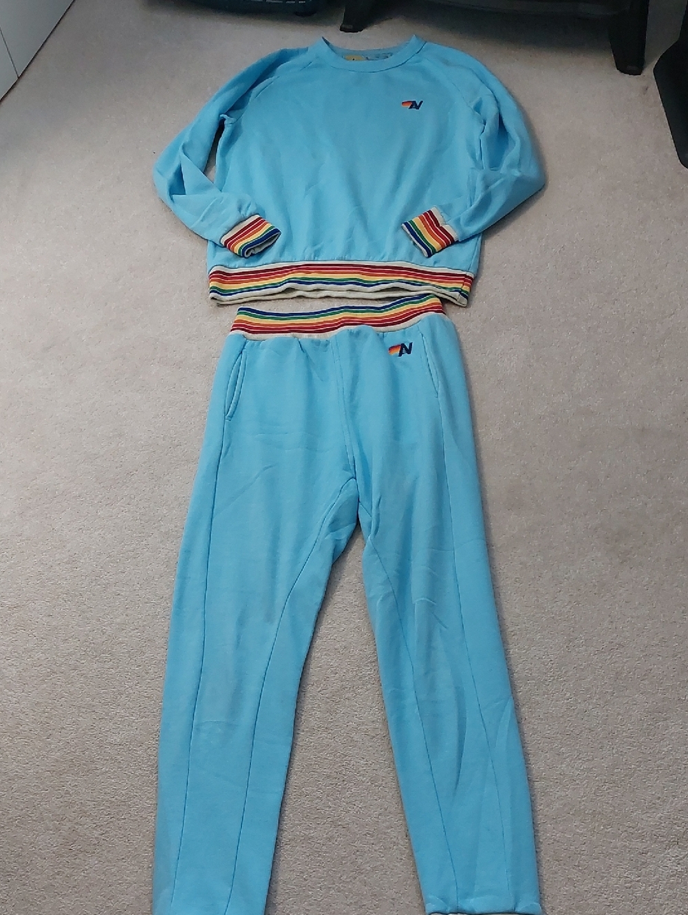 Aviator Nation Womab Light Blue Sweatshirt & Jogger Set with Rainbow Trim.